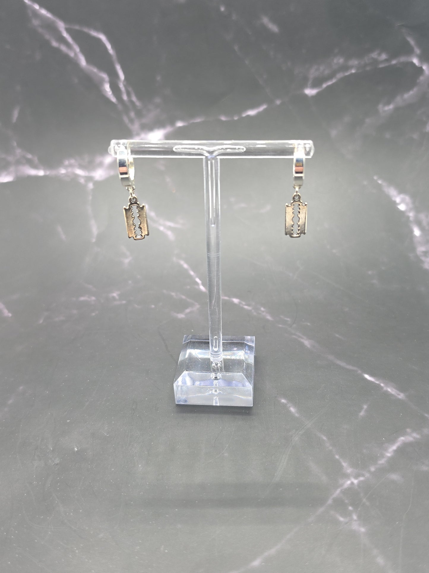 Close-up of The Peeps Dangle Style Huggie Earrings featuring a secure huggies clasp and delicate dangler style, ideal for everyday elegance.